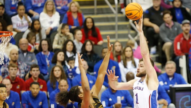 Kansas senior center Hunter Dickinson (1) shoots for two against Wichita State during the second half of Saturday's game inside T-Mobile Center in Kansas City.